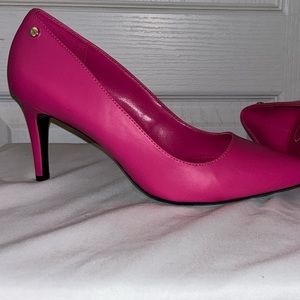 Pink Calvin Klein pumps.